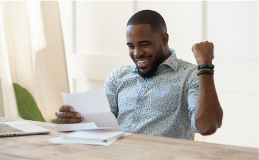 Career at Hamilton. Man excited while reading employment offer.